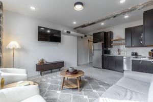 a living room with a couch and a table at Park Hotel 2BR Suite 406 in Chattanooga +24 photos
