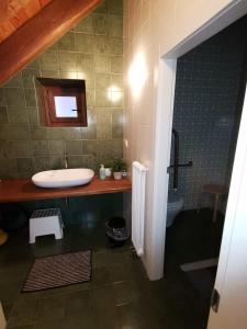 a bathroom with a sink and a toilet at Antico Borgo 2 in Cadarese