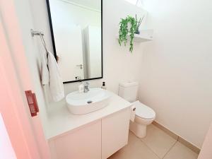 a bathroom with a sink and a toilet at Little Acorn in Hermanus +25 photos