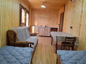 a living room with a couch and a table at Shiraz in Agarak