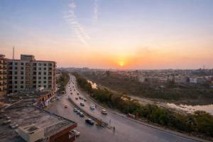 a view of a city with traffic on a street at The Nest Apartment in Rawalpindi