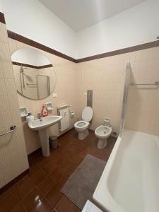 a bathroom with a sink and a toilet and a tub at Casa Francesco in Rapallo +16 photos
