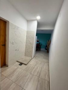 a hallway with a stone wall and a floor at Cabana Alojamiento Turistico in Humahuaca +14 photos