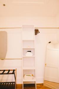 a room with white shelves and a mirror at The Historic Hattie House in Abingdon +3 photos