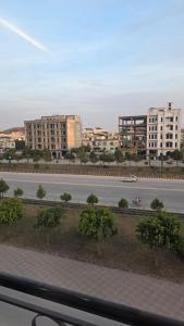 a view of a street in a city with buildings at Skyline Central Apartments in Islamabad