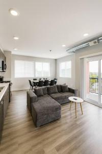 a living room with a couch and a table at Axis Suite in Des Moines