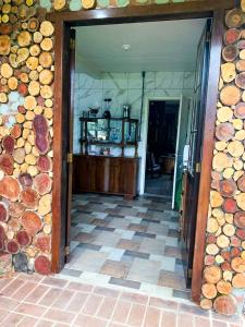 a hallway with a pile of fire wood at Cabana Refúgio do Recanto in São Valentim do Sul