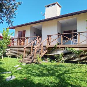 a house with wooden stairs in front of it at Residencial Franzen in Canela