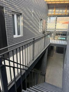 a stairway leading up to a building with a window at Meridian Hotel in Almaty