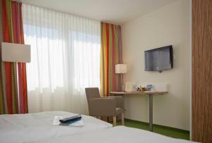 מיטה או מיטות בחדר ב-Hotel am Markt Garni - Aegidienberg