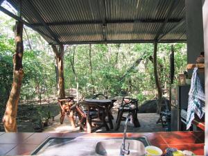 a kitchen with a table and a dog in the background at Cielo y Tierra in Santa Cruz