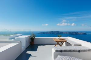 a balcony with a view of the ocean at Ocean Caldera View Villa by Dalmyra Estate in Imerovigli