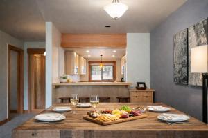 a table with a tray of food and wine glasses at Lodge Condo 031 in Black Butte Ranch