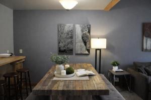 a living room with a wooden table and a couch at Lodge Condo 031 in Black Butte Ranch