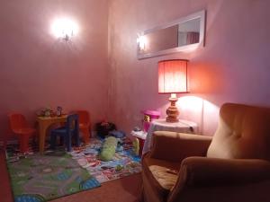 a living room with a pile of toys on the floor at Garda City Home Family Apartments in Garda +92 photos