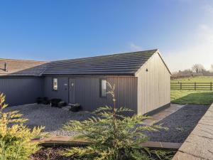 a house with a black roof at Fleetwood in Richmond