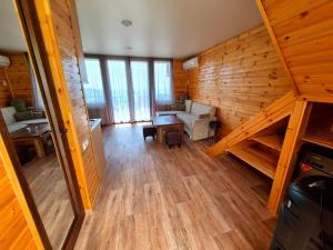 an overhead view of a living room with wooden walls at tsilo in Batumi +4 photos