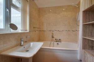 a bathroom with a sink and a bath tub at 3 Bed in Walcott oc-2135 in Walcott +14 photos