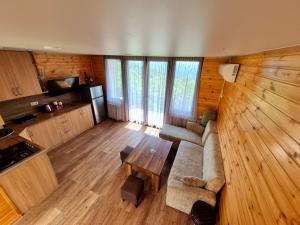 a living room with a couch and a table at tsilo in Batumi