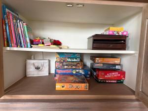 a book shelf filled with lots of books at Maison François in Oostkamp