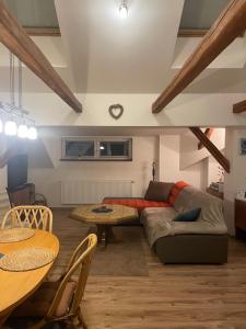 a living room with a couch and a table at Apartment Krkonošská in Tanvald