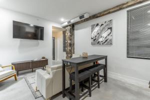 a living room with a table and a couch at Park Hotel 1BR Suite 410 in Chattanooga