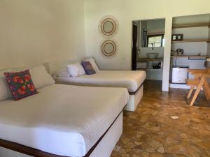 a living room with two beds and a couch at Rancho Eden in Armenia