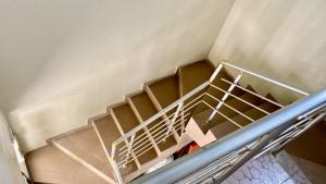 an overhead view of a staircase in a room at Résidence Le Petit Manoir in Cotonou