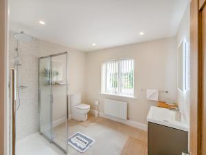 a bathroom with a shower and a toilet and a sink at 3 Bed in Cashel oc-a32863 in Glinsk +21 photos