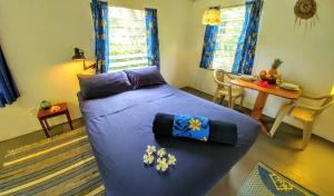 Postel nebo postele na pokoji v ubytování Matriki Beach Huts
