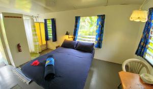 Postel nebo postele na pokoji v ubytování Matriki Beach Huts