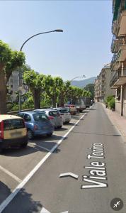 a street with cars parked in a parking lot at Appartamento Denis in Rapallo