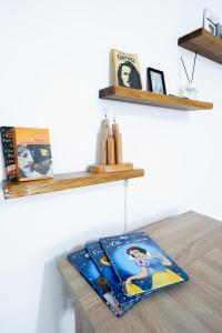 a table with a book on top of it at Apartament centru in Râmnicu Vâlcea