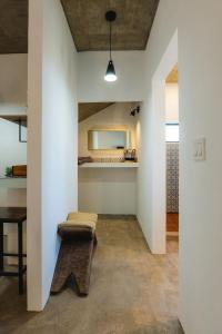 a room with a bench and a mirror on the wall at Ola in San Carlos +5 photos