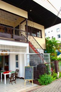 a restaurant with a sign in front of a building at Nr 1 Spot in Paramaribo