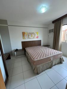 a bedroom with a large bed in a room at Privê Boulevard Suíte Hotel - 706 - Caldas Novas GO in Caldas Novas