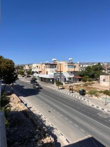a view of a road in a city with buildings at Forty Columns flat in Paphos