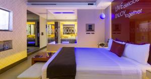 a bedroom with a large bed in a store at V Boutique Viaducto in Mexico City
