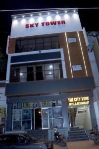a building with a motorcycle parked in front of it at The City View- Hotel and Restaurant in Bhiwāni
