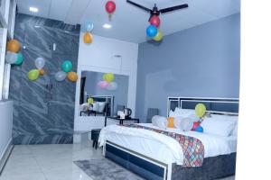 a bedroom with a bed with balloons on the ceiling at The City View- Hotel and Restaurant in Bhiwāni +19 photos