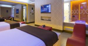 a hotel room with two beds and a room with at V Boutique Viaducto in Mexico City