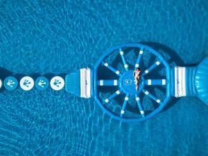 an overhead view of a mans watch in a swimming pool at SO/ Sofitel Hua Hin in Cha Am
