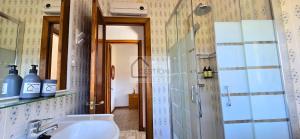 a bathroom with a sink and a shower at Villa Trinamar - Casa rural en Valdes cerca de Luarca in Carcedo +34 photos