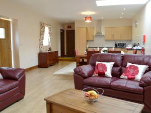 a living room with two couches and a table at The Parlour - Op4 in Carmarthen