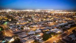 an aerial view of a city at night at Cozy Retreat with Pool, BBQ and Fire Pit in Indio