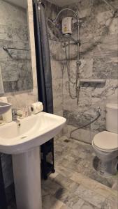 a bathroom with a sink and a toilet at PB325 Ideal studio apartment in Phuket in Ban Mai Salae +8 photos
