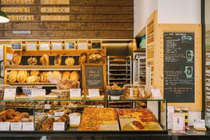 a bakery with many different types of bread and pastries at The Cove Hotel - Plateau Mont-Royal in Montreal