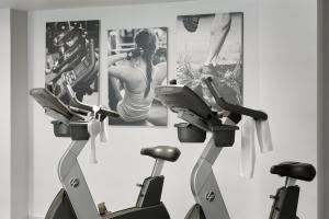 a group of three exercise bikes in a room at Fiesta Inn Monterrey la Fe in Monterrey