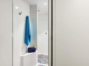 a door to a bathroom with a towel on it at HOTELF1 Le Havre Est - Gonfreville in Gonfreville-lʼOrcher