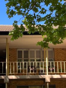 a balcony of a house with a table and chairs at Campbell comfort and convenience in Campbell